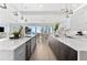 Bright kitchen featuring dual islands, modern design, and ocean views at 32 Gulf Blvd, Indian Rocks Beach, FL 33785