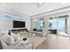 Cozy living room with ocean view, stylish sofas, and bright natural light at 32 Gulf Blvd, Indian Rocks Beach, FL 33785