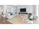 Bright living room with sleek fireplace, modern furniture, and stylish decor at 32 Gulf Blvd, Indian Rocks Beach, FL 33785