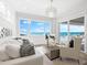 Chic living room with a stunning ocean view and stylish furnishings at 32 Gulf Blvd, Indian Rocks Beach, FL 33785