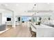 Bright open living space with ocean views, modern kitchen, and dining area at 32 Gulf Blvd, Indian Rocks Beach, FL 33785