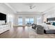 Bright bedroom with balcony access, ocean views, and modern interior design at 32 Gulf Blvd, Indian Rocks Beach, FL 33785