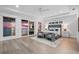 Bright main bedroom features a balcony, ocean view, and modern furnishings at 32 Gulf Blvd, Indian Rocks Beach, FL 33785