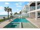 Gorgeous pool area with beach views, chairs, and access to the main house at 32 Gulf Blvd, Indian Rocks Beach, FL 33785