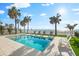 Stunning backyard pool area with lounge chairs, lush grass, and beach views at 32 Gulf Blvd, Indian Rocks Beach, FL 33785
