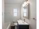 Bathroom with tiled shower and vanity with modern fixtures at 3220 10Th N St, St Petersburg, FL 33704