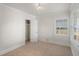 Bedroom with neutral carpet, crown molding, and a window bringing in natural light at 3220 10Th N St, St Petersburg, FL 33704