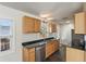Modern kitchen featuring stainless steel appliances, granite countertops, and ample cabinet space at 3220 10Th N St, St Petersburg, FL 33704