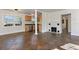 Open living area with stone tile, fireplace, and easy flow to the kitchen and other rooms at 3220 10Th N St, St Petersburg, FL 33704