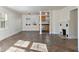 Bright living room with fireplace, stone tile flooring, and open access to the kitchen at 3220 10Th N St, St Petersburg, FL 33704