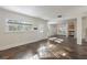 Open-concept living room with stone tile flooring, bright windows, and ample natural light at 3220 10Th N St, St Petersburg, FL 33704