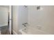 Shower with white tile and decorative flower at 3220 10Th N St, St Petersburg, FL 33704