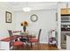 A lovely dining area is showcased with a glass table, comfortable built-in seating, and stylish decor at 3310 Haviland Ct # 202, Palm Harbor, FL 34684