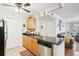 Functional kitchen featuring light wood cabinets, stainless steel appliances, and convenient access at 3310 Haviland Ct # 202, Palm Harbor, FL 34684