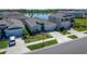 Aerial view of a single Gathering home that is located next to a lake at 33298 Major Oak Dr, Wesley Chapel, FL 33545