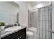 Cozy bathroom featuring a bathtub, shower combo, modern vanity with a decorative sink at 33298 Major Oak Dr, Wesley Chapel, FL 33545