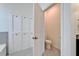 Bathroom featuring a separate toilet and linen closet at 33298 Major Oak Dr, Wesley Chapel, FL 33545
