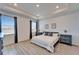 Bright bedroom with recessed lighting, wood-look floors, and stylish nightstands at 33298 Major Oak Dr, Wesley Chapel, FL 33545