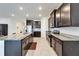 Beautiful modern kitchen featuring stainless steel appliances, granite countertops, and tile floors at 33298 Major Oak Dr, Wesley Chapel, FL 33545