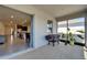 Screened patio with view to open floor plan kitchen and dining area at 33298 Major Oak Dr, Wesley Chapel, FL 33545