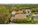An aerial view of the property with mature trees showcasing the home's location on a quiet street at 3543 Watermark Dr, Wesley Chapel, FL 33544