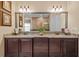 Bathroom with double vanity, granite countertops, and decorative mirror at 3543 Watermark Dr, Wesley Chapel, FL 33544
