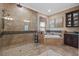 Bathroom featuring walk in shower, soaking tub and custom tile work at 3543 Watermark Dr, Wesley Chapel, FL 33544