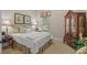 Comfortable bedroom with a classic decor, complemented by a window with natural light at 3543 Watermark Dr, Wesley Chapel, FL 33544