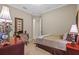 Comfortable bedroom featuring a classic desk, decor and neutral tones at 3543 Watermark Dr, Wesley Chapel, FL 33544