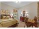 Inviting bedroom featuring decor, a classic desk, and a window at 3543 Watermark Dr, Wesley Chapel, FL 33544