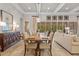 Dining area with a long table, stylish chairs, and seamless integration with the living space at 3543 Watermark Dr, Wesley Chapel, FL 33544