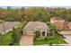 A beautiful two-story home featuring manicured landscaping, a well-maintained lawn, and a brick-paved driveway at 3543 Watermark Dr, Wesley Chapel, FL 33544