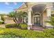 Charming front porch with stylish seating and meticulous landscaping, perfect for relaxing at 3543 Watermark Dr, Wesley Chapel, FL 33544