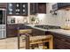 Kitchen with stainless steel appliances, pull out spice rack and granite countertops at 3543 Watermark Dr, Wesley Chapel, FL 33544