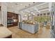 Open kitchen with a large island, modern appliances, and seamless flow to the living spaces at 3543 Watermark Dr, Wesley Chapel, FL 33544