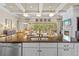 Gourmet kitchen with island, granite countertops, stainless appliances, and open floor plan at 3543 Watermark Dr, Wesley Chapel, FL 33544