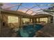 A serene screened-in pool area with ample patio space perfect for outdoor relaxation and entertainment at 3543 Watermark Dr, Wesley Chapel, FL 33544