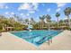 Beautiful swimming pool features marked lanes, blue water, a water slide, and plenty of lounge chairs at 3543 Watermark Dr, Wesley Chapel, FL 33544