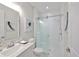 Bright bathroom with a glass-enclosed shower, modern fixtures, and clean, white finishes at 3915 W Euclid Ave, Tampa, FL 33629