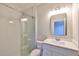 Modern bathroom with white subway tile shower and marble countertop vanity at 3915 W Euclid Ave, Tampa, FL 33629