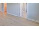 Bright bedroom featuring wood floors, closet and bathroom entries and neutral tones at 3915 W Euclid Ave, Tampa, FL 33629
