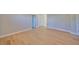 Spacious bedroom with neutral walls, white trim, and light hardwood floors at 3915 W Euclid Ave, Tampa, FL 33629