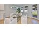 Dining area with glass table, modern chairs, and natural light at 3915 W Euclid Ave, Tampa, FL 33629