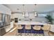 Modern kitchen with stainless steel appliances, large island, and sleek design at 3915 W Euclid Ave, Tampa, FL 33629
