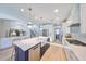 Bright kitchen with a large island, stainless steel appliances and farmhouse sink at 3915 W Euclid Ave, Tampa, FL 33629