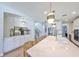 Bright kitchen with a large island, stainless steel appliances, and wood floors at 3915 W Euclid Ave, Tampa, FL 33629