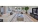 Bright living room with modern furnishings, wood floors, and natural light at 3915 W Euclid Ave, Tampa, FL 33629