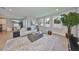 Spacious living room with wood floors, neutral colors, modern furnishings and natural light at 3915 W Euclid Ave, Tampa, FL 33629