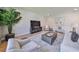 Living room featuring modern decor, neutral colors, and a large TV at 3915 W Euclid Ave, Tampa, FL 33629