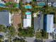 Aerial view showcasing neighborhood homes and their swimming pools on a bright, sunny day at 409 Erie Ave, Tampa, FL 33606